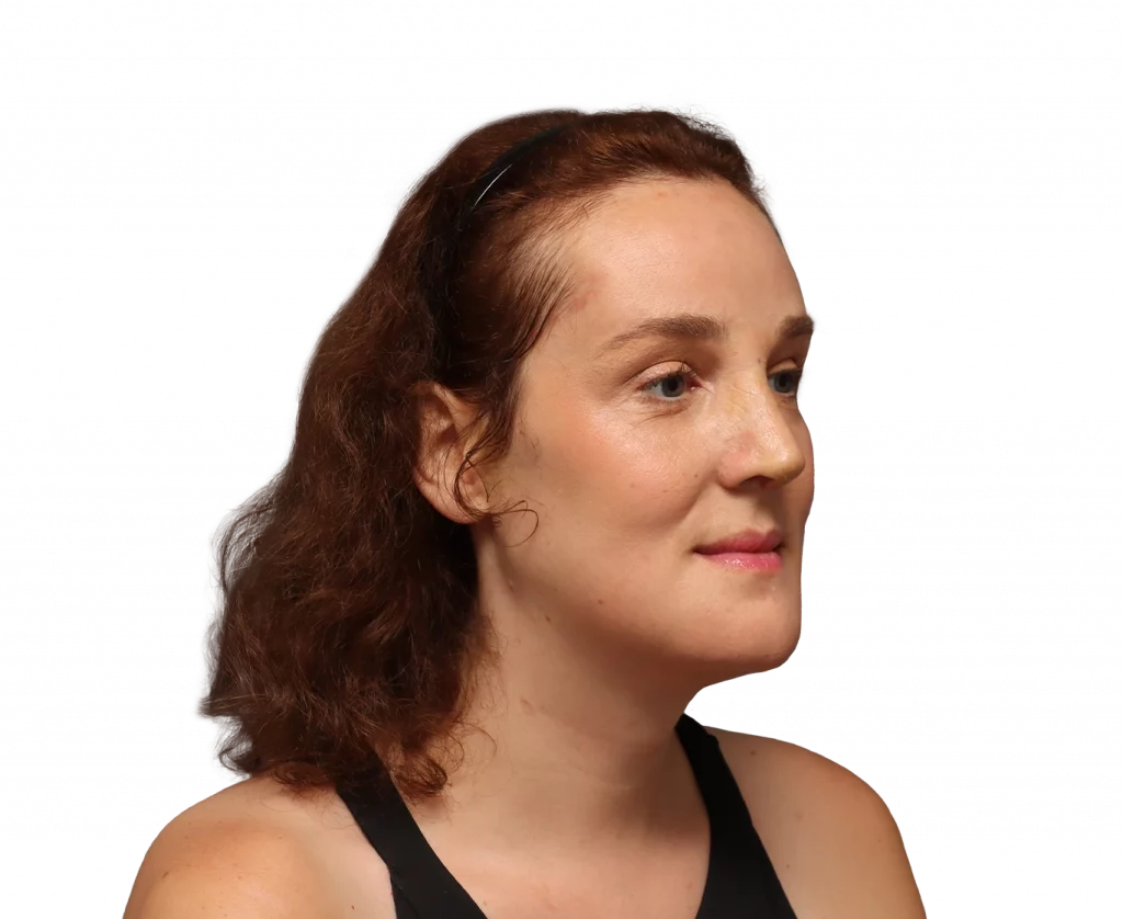 Profile portrait of a woman with curly brown hair and a black headband, facing right in a sleeveless black top.