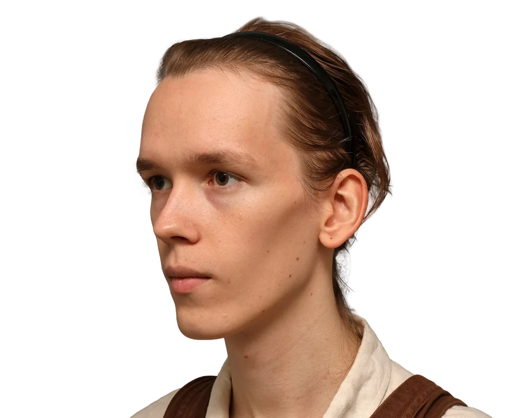 Young woman in profile facing left, with brown hair pulled back and a black headband, wearing beige clothing.